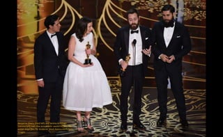 Benjamin Cleary (third left) and Serena Armitage
(second left) and crew accept their award for best live
action short film, for Stutterer. Mark Ralston/AFP/Getty
Images
 