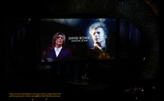 Singer and actor David Bowie is shown on screen as singer Dave Grohl
performs during the In Memoriam segment. REUTERS/Mario Anzuoni
 