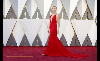 Presenter Charlize Theron arrives. REUTERS/Lucy Nicholson
 