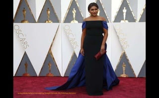 Actress Mindy Kaling arrives wearing Elizabeth Kennedy. REUTERS/Lucy Nicholson
 