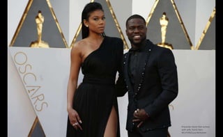 Presenter Kevin Hart arrives
with wife Torrei Hart.
REUTERS/Lucy Nicholson
 