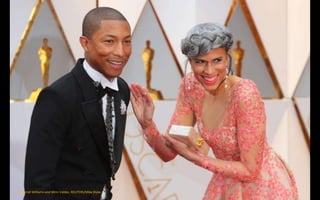 Pharrell Williams and Mimi Valdes. REUTERS/Mike Blake
 