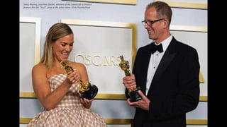 Dana Murray, and Pete Docter, winners of the award for animated
feature film for "Soul", pose in the press room. Chris Pizzello/Pool
 