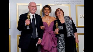 Donald Graham Burt and Jan Pascale pose in the press room with
the award for best production design for "Mank" with Halle Berry.
Chris Pizzello/Pool
 