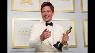 Thomas Vinterberg from Denmark poses with the award for best international feature film for "Another Round" in the press room. Chris Pizzello/Pool
 