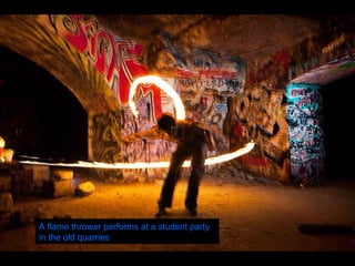A flame thrower performs at a student party in the old quarries   
