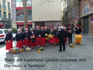 These are traditional Catalan costumes and
the music is 'Sardana'.

 
