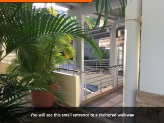 You will see this small entrance to a sheltered walkway
 