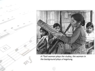 A T'boli woman plays the sludoy, the woman in the background plays a hegelung.
