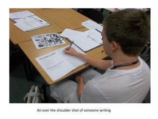 An over the shoulder shot of someone writing
 