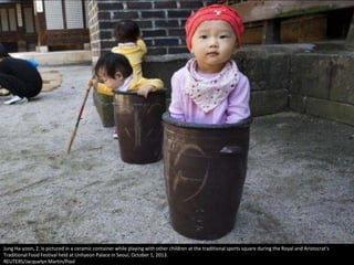 Jung Ha-yoon, 2, is pictured in a ceramic container while playing with other children at the traditional sports square dur...