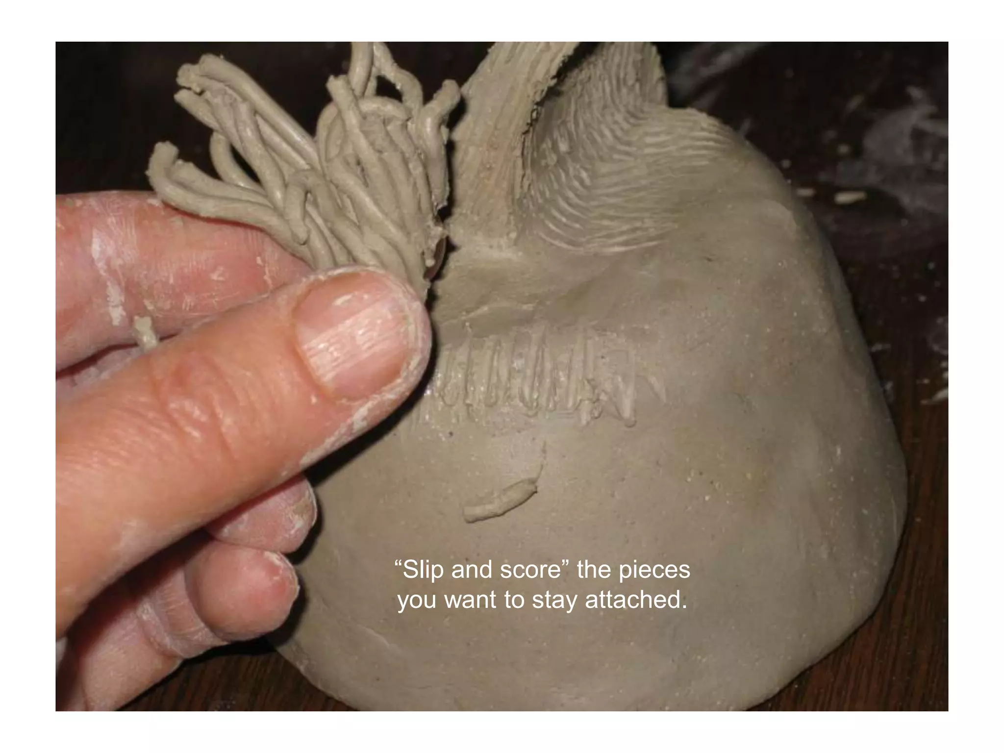 “Slip and score” the pieces you want to stay attached.