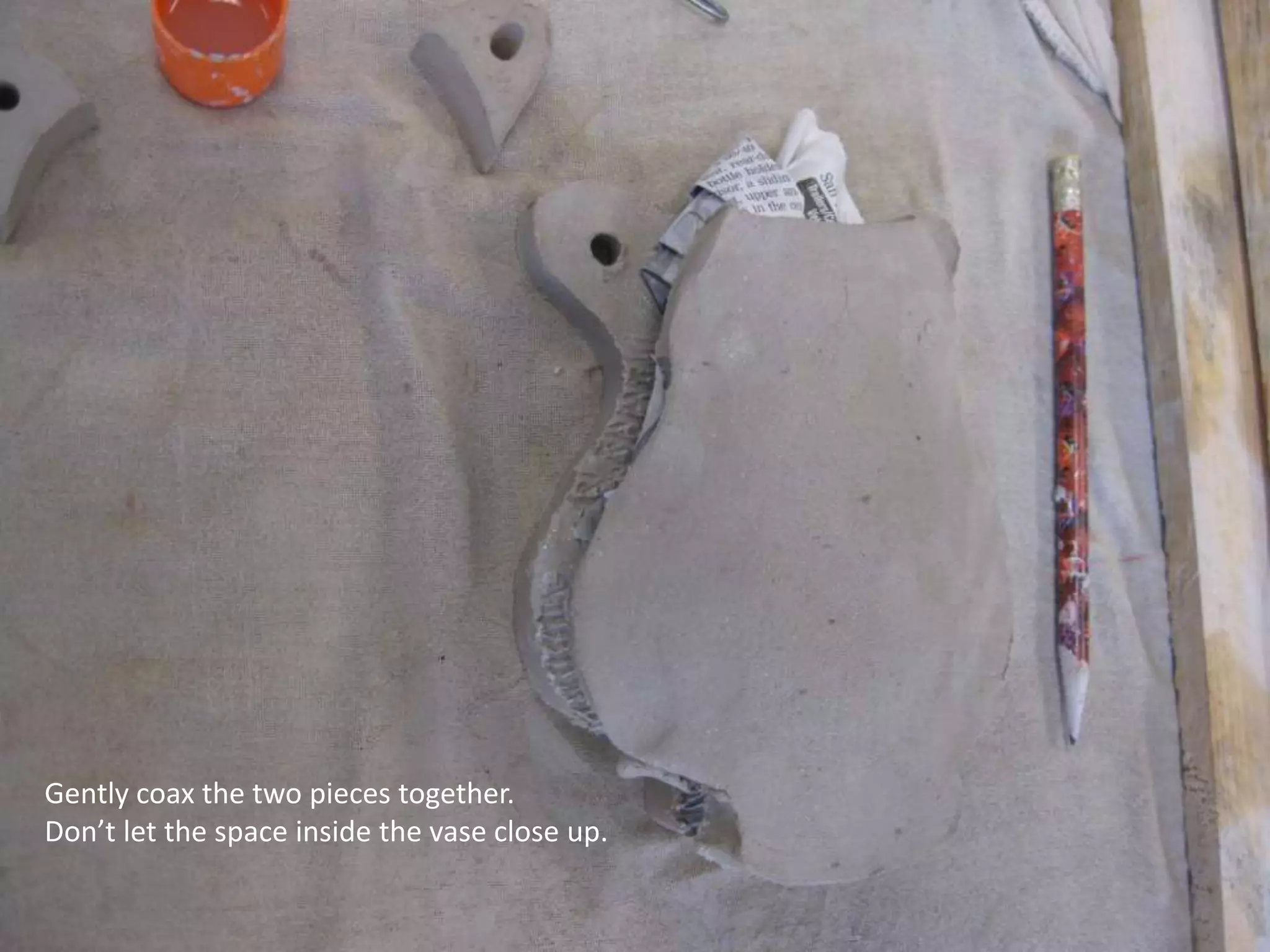 Gently coax the two pieces together. Don’t let the space inside the vase close up.