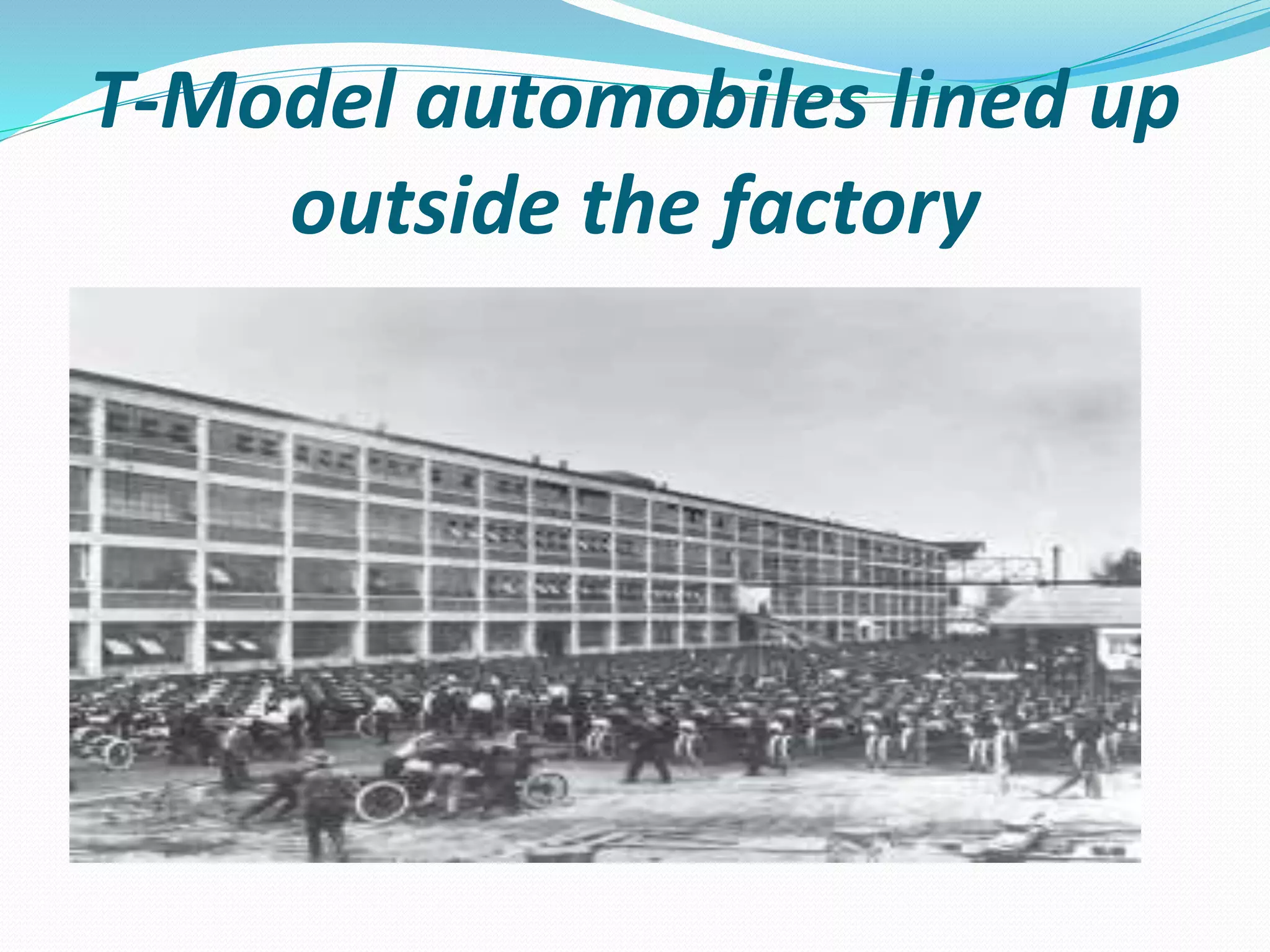 T-Model automobiles lined up
outside the factory
 