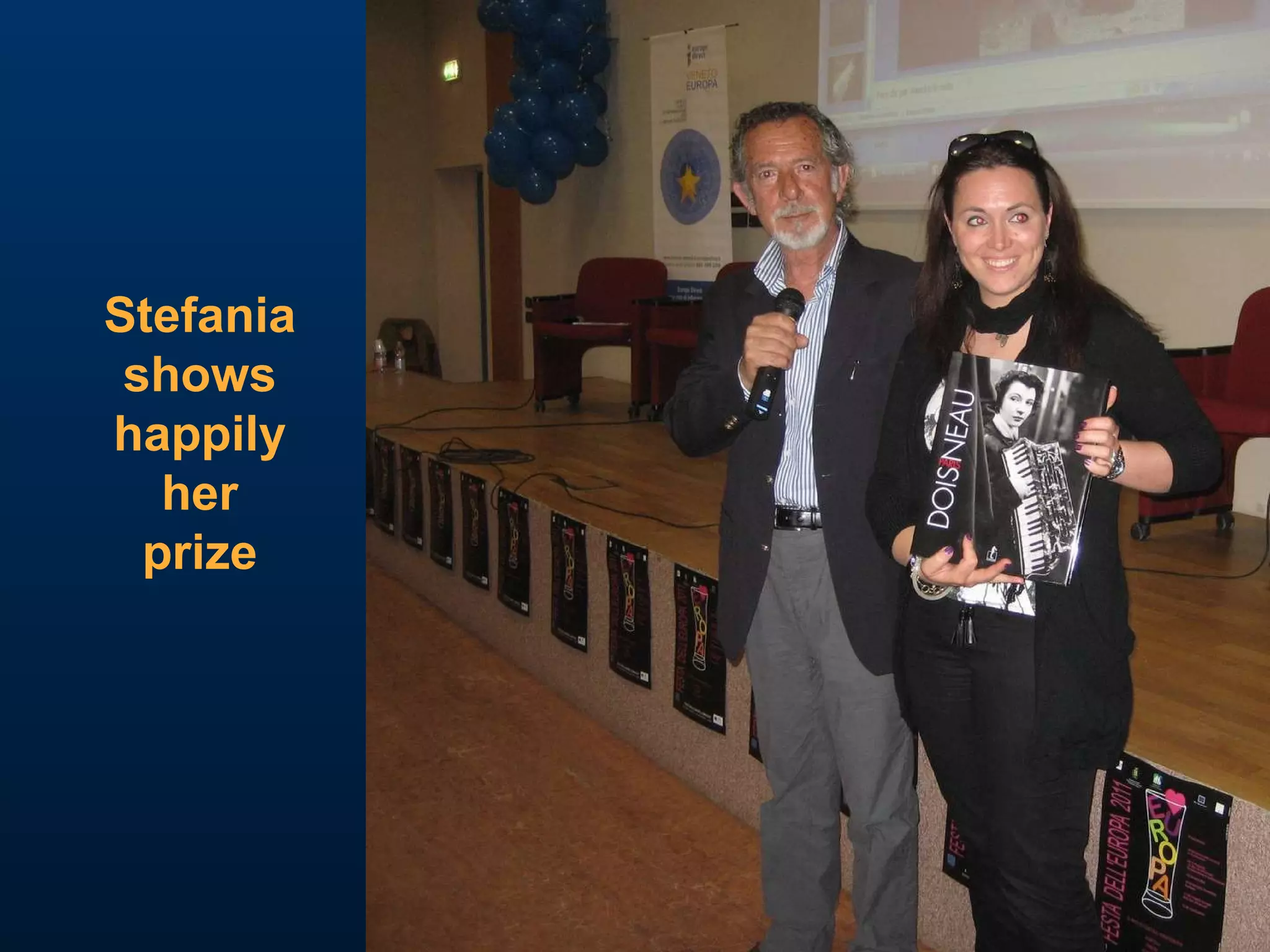 Stefania shows happily her prize 