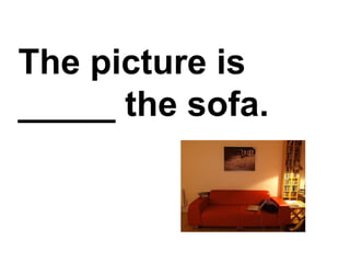 The picture is _____ the sofa.