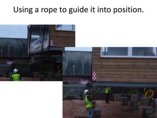 Using a rope to guide it into position.
 