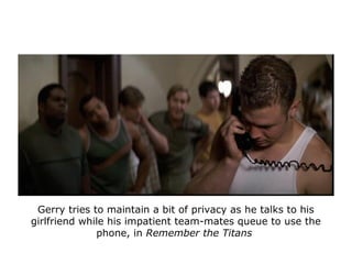 Gerry tries to maintain a bit of privacy as he talks to his
girlfriend while his impatient team-mates queue to use the
pho...