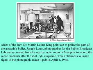 Aides of the Rev. Dr. Martin Luther King point out to police the path of
the assassin's bullet. Joseph Louw, photographer for the Public Broadcast
Laboratory, rushed from his nearby motel room in Memphis to record the
scene moments after the shot. Life magazine, which obtained exclusive
rights to the photograph, made it public. April 4, 1968.
 