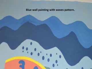 Blue wall painting with waves pattern.
 