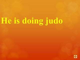 He is doing judo 
 