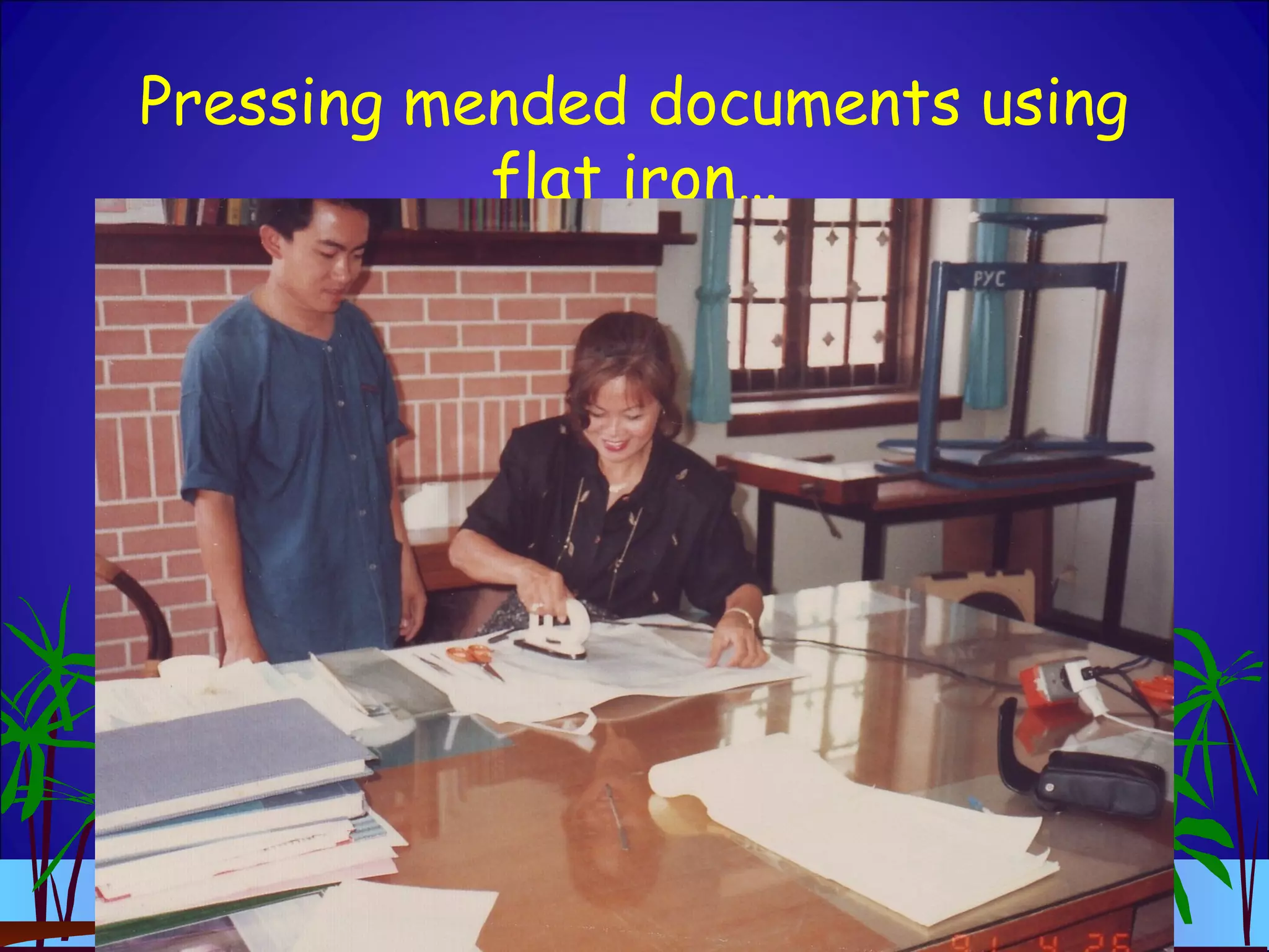 Pressing mended documents using
flat iron…
 