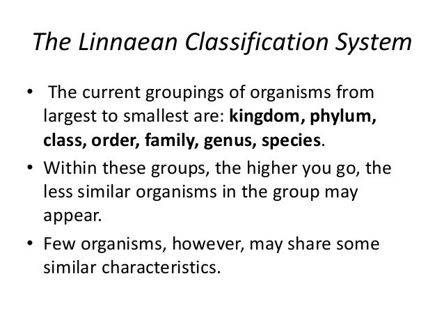 How did Carl Linnaeus group organisms?