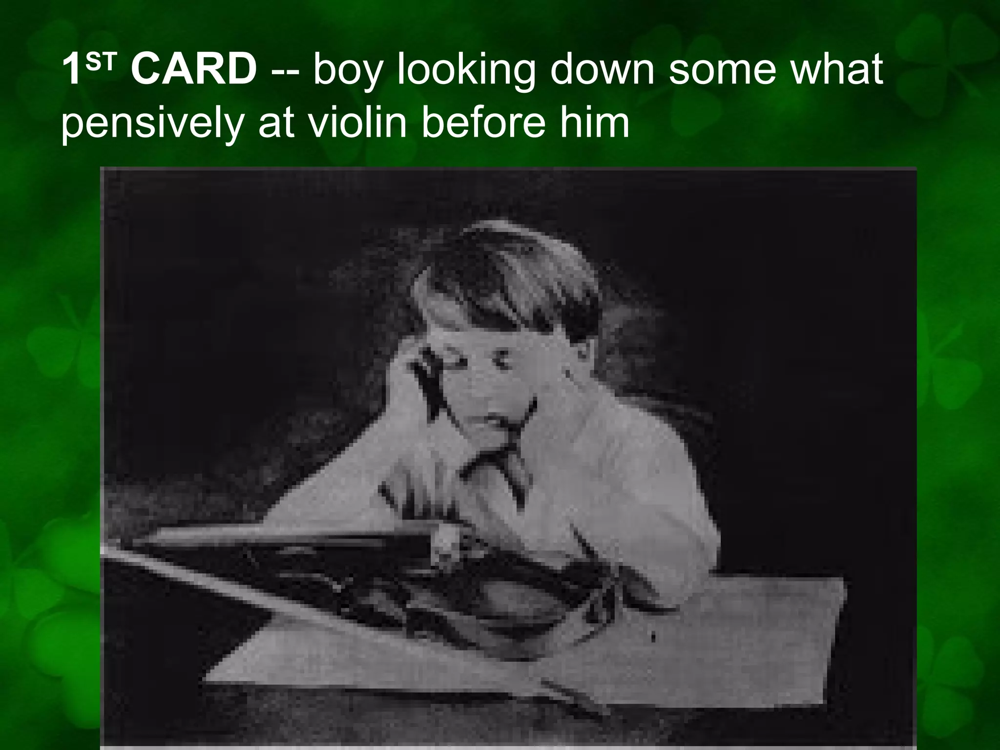 1ST CARD -- boy looking down some what
pensively at violin before him

 