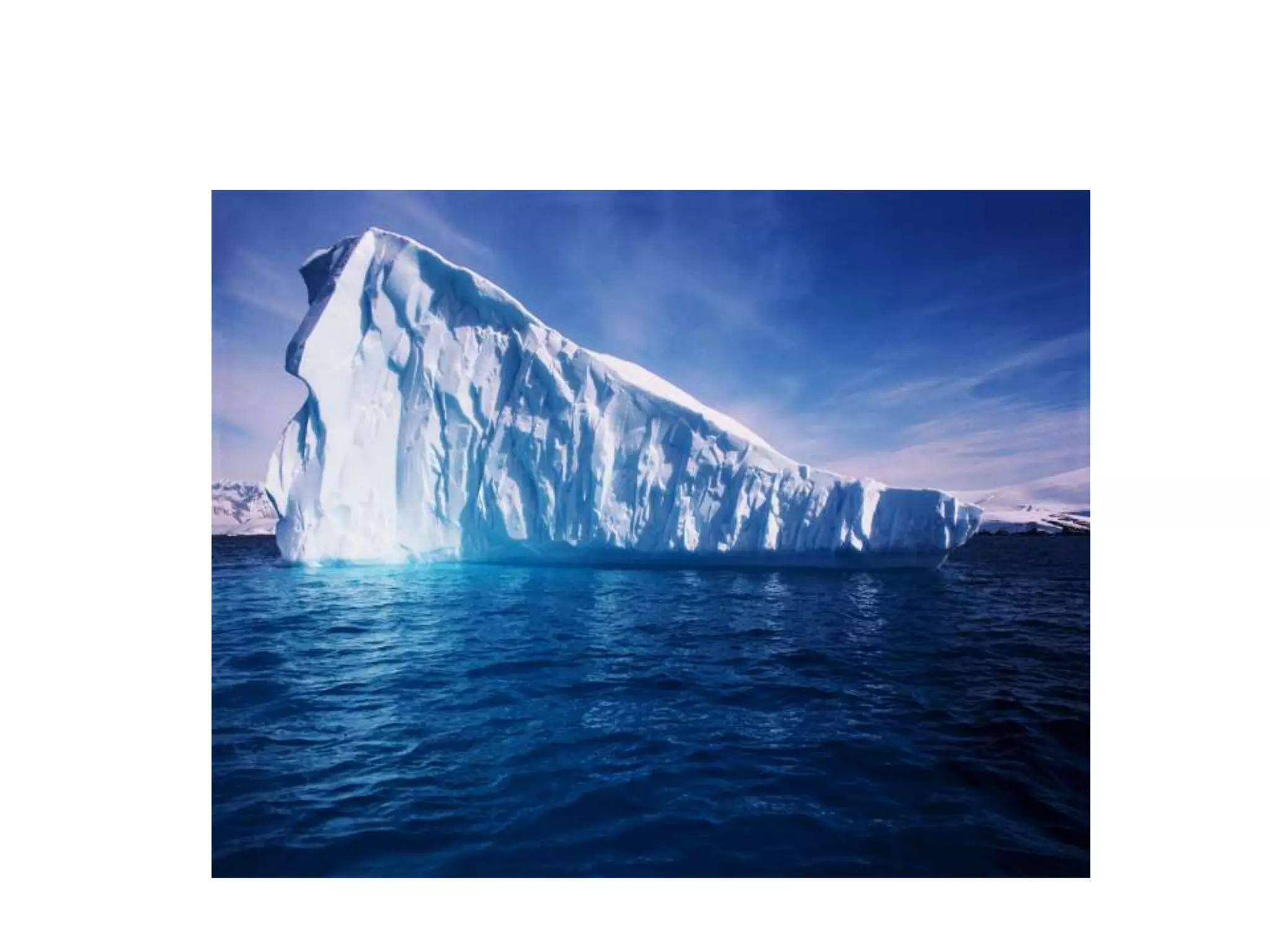 Water at 0°C is solid ice, but is less dense than water, so ice floats!!Water is the only material whose solid form will float in its liquid form.This is why the top of a puddle, or a lake freezes first.