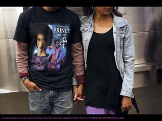 A couple watches on as fans gather at Harlem's Apollo Theater to celebrate the life of Prince in the Manhattan. REUTERS/Andrew Kelly
 
