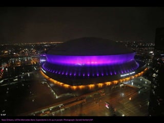 New Orleans, USThe Mercedes-Benz Superdome is lit up in purple. Photograph: Gerald Herbert/AP
 