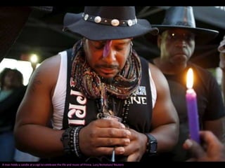 A man holds a candle at a vigil to celebrate the life and music of Prince. Lucy Nicholson/ Reuters
 