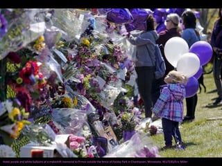 Holds purple and white balloons at a makeshift memorial to Prince outside the fence of Paisley Park in Chanhassen, Minnesota. REUTERS/Eric Miller
 