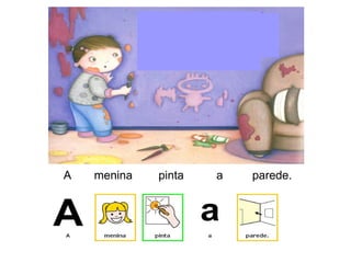 A menina pinta a parede.
 