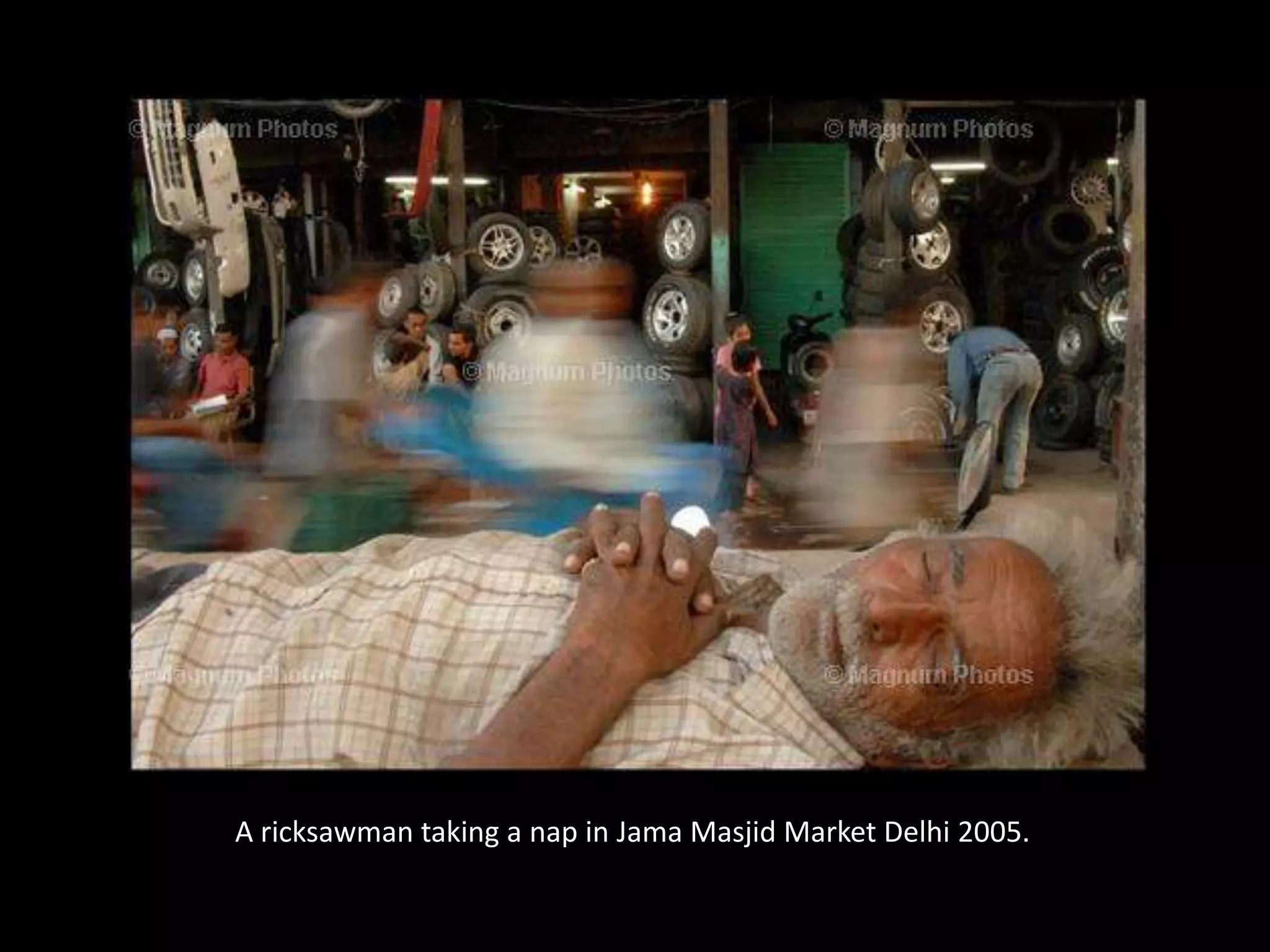 A ricksawman taking a nap in JamaMasjid Market Delhi 2005.