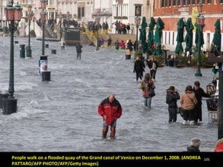 People walk on a flooded quay of the Grand canal of Venice on December 1, 2008. (ANDREA PATTARO/AFP PHOTO/AFP/Getty Images) 