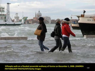 15People walk on a flooded oceanside walkway of Venice on December 1, 2008. (ANDREA PATTARO/AFP PHOTO/AFP/Getty Images 