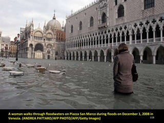 A woman walks through floodwaters on Piazza San Marco during floods on December 1, 2008 in Venezia. (ANDREA PATTARO/AFP PHOTO/AFP/Getty Images) 