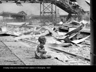 A baby cries at a bombed train station in Shanghai, 1937.
 