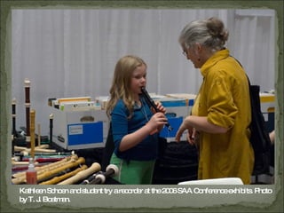 Kathleen Schoen and student try a recorder at the 2006 SAA Conference exhibits. Photo by T. J. Boatman. 