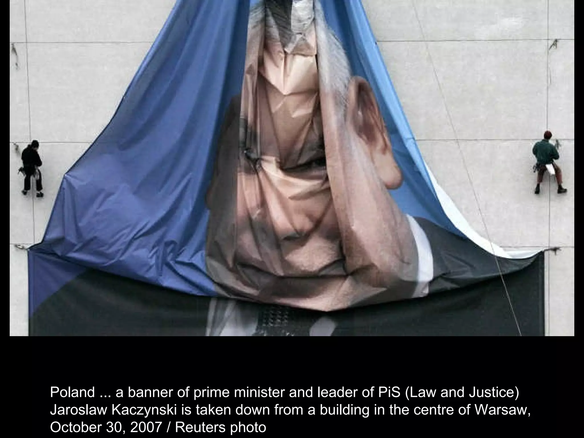 Poland ... a banner of prime minister and leader of PiS (Law and Justice)  Jaroslaw Kaczynski is taken down from a building in the centre of Warsaw,  October 30, 2007 / Reuters photo  