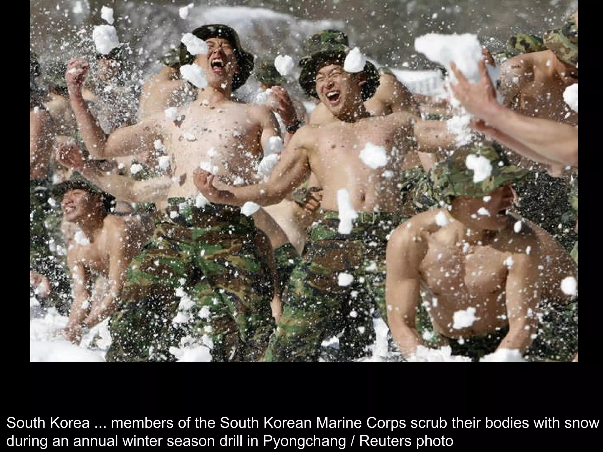 South Korea ... members of the South Korean Marine Corps scrub their bodies with snow  during an annual winter season drill in Pyongchang / Reuters photo  