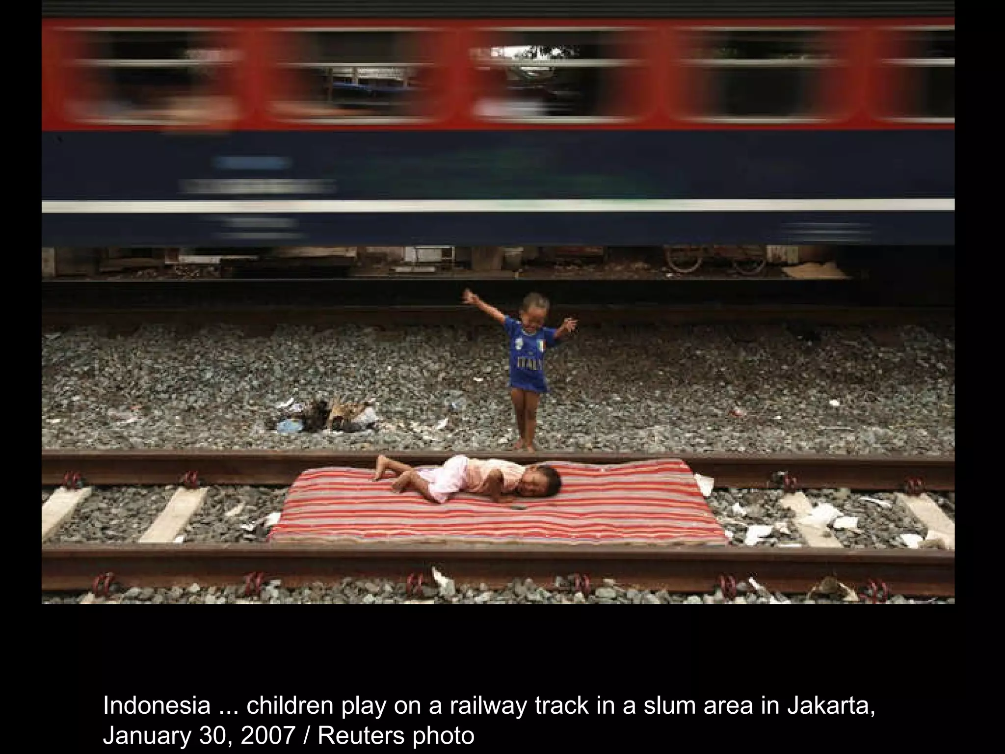 Indonesia ... children play on a railway track in a slum area in Jakarta,  January 30, 2007 / Reuters photo  