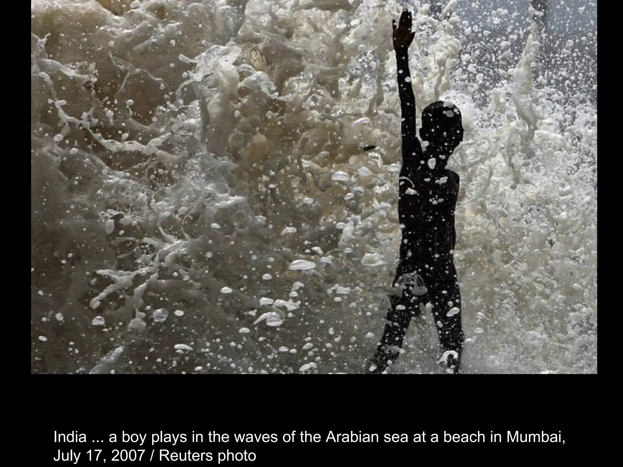 India ... a boy plays in the waves of the Arabian sea at a beach in Mumbai,  July 17, 2007 / Reuters photo  