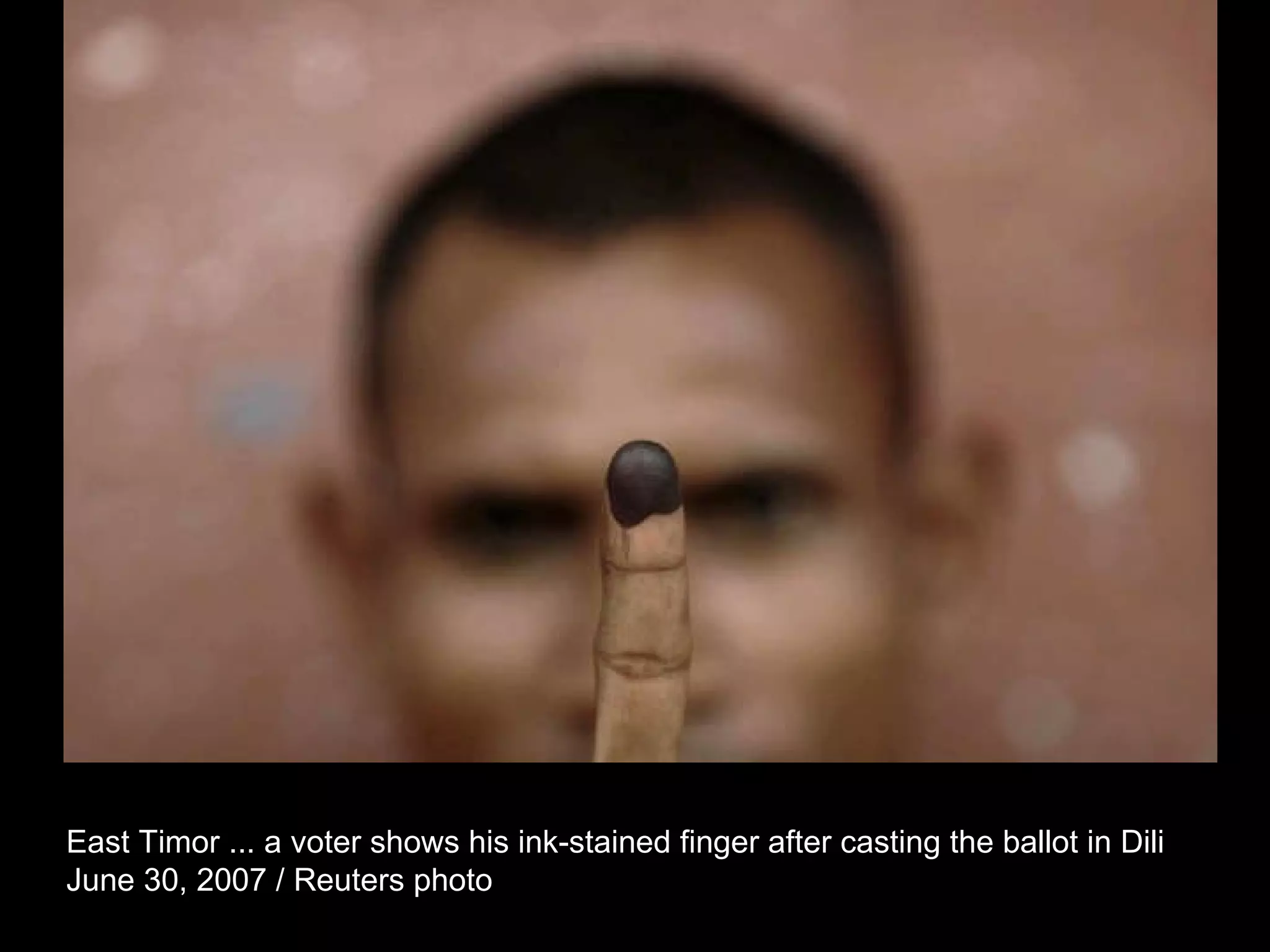 East Timor ... a voter shows his ink-stained finger after casting the ballot in Dili  June 30, 2007 / Reuters photo  