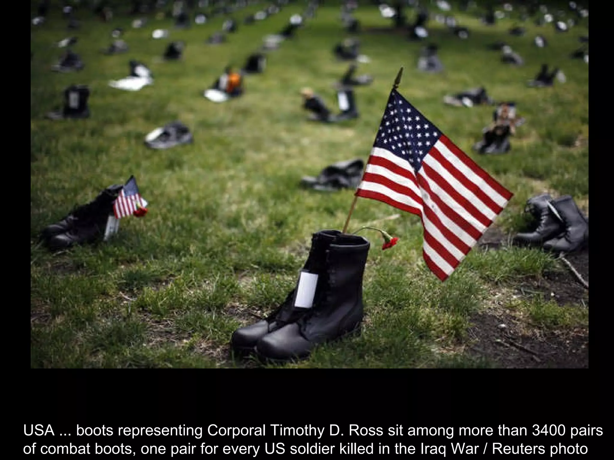 USA ... boots representing Corporal Timothy D. Ross sit among more than 3400 pairs  of combat boots, one pair for every US soldier killed in the Iraq War / Reuters photo  