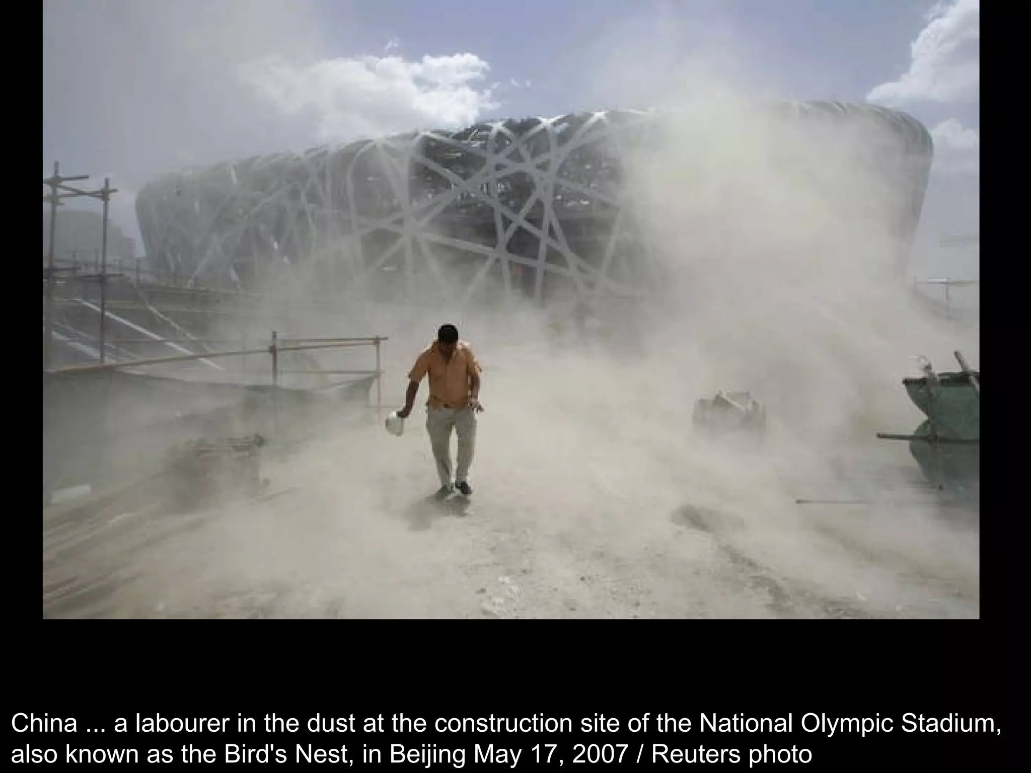 China ... a labourer in the dust at the construction site of the National Olympic Stadium,  also known as the Bird's Nest, in Beijing May 17, 2007 / Reuters photo  