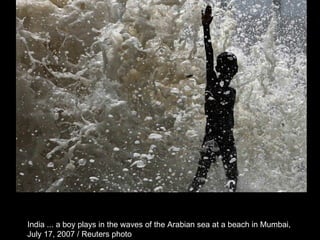 India ... a boy plays in the waves of the Arabian sea at a beach in Mumbai,  July 17, 2007 / Reuters photo  
