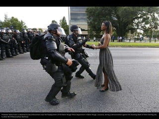 Protester Ieshia Evans is detained by law enforcement near the headquarters of the Baton Rouge Police Department in Baton Rouge, Louisiana, during a demonstration against the shooting death of Alton Sterling July
9, 2016. REUTERS/Jonathan Bachman
 