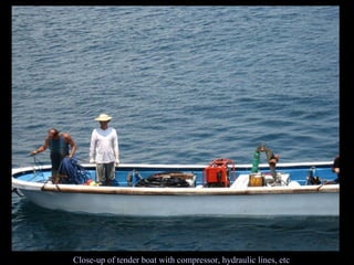 Close-up of tender boat with compressor, hydraulic lines, etc 